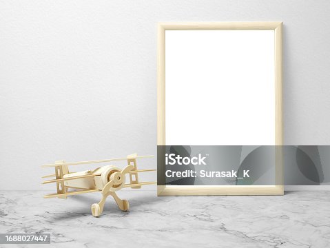 istock Blank frames mockup on marble floor with wooden plane 1688027447