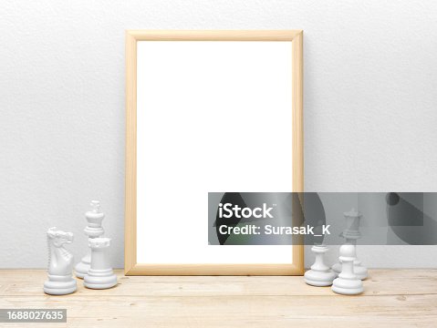 istock Blank frames mockup on wooden floor with chess 1688027635
