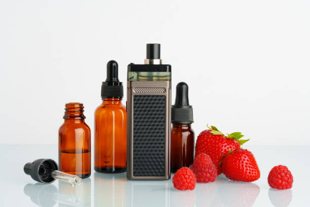 istock Electronic cigarette liquid with strawberry flavor on white background 1688032590