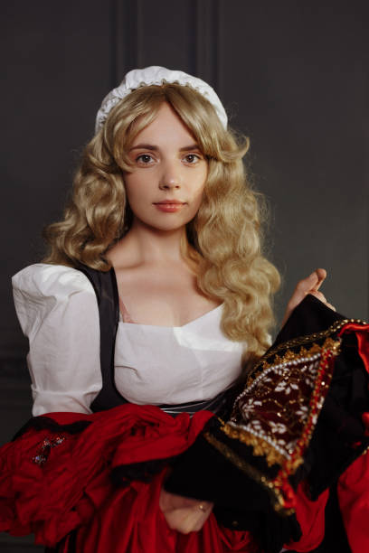 istock Medieval Seamstress with Vintage Dress. 1688033080
