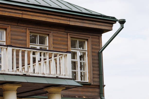 istock Rustic Two-Story Wooden House with Classic White Balcony 1688037494