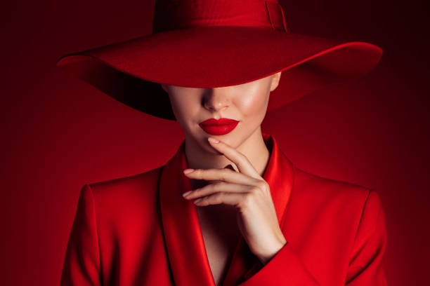 istock Beautiful girl with make-up wearing red jacket and hat 1688040224