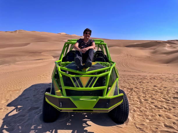 istock Buggy dune ride in the desert 1688045138