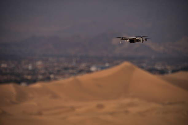 istock Drone flying above sand dunes in Peru 1688045140