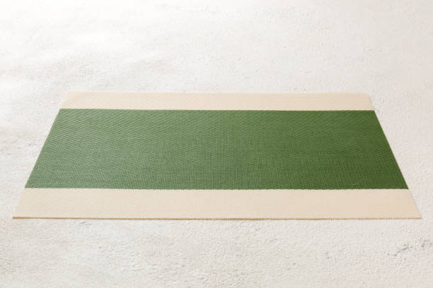 istock Perspective view of green tablecloth for food on cement background. Empty space for your design 1688068614