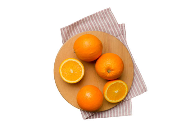 istock Fresh ripe oranges on cutting board isolated on white background. Top view Flat lay 1688068882
