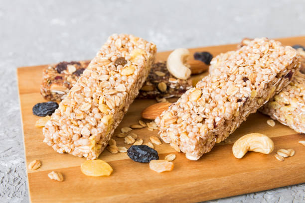 istock Various granola bars on table background. Cereal granola bars. Superfood breakfast bars with oats, nuts and berries, close up. Superfood concept 1688069135