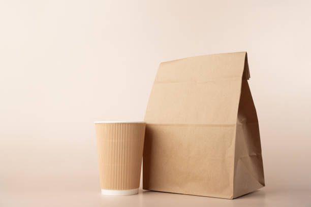 istock Lunch bag with coffee cup, breakfast delivery, responsible 1688096113