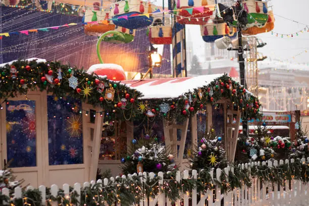 christmas market,stall houses with gifts,winter holiday tourism, atmospheric lights
