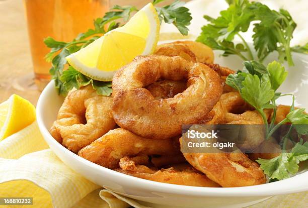 Fried Squid Rings Dipped In Batter Stock Photo - Download Image Now - Appetizer, Calamari, Circle