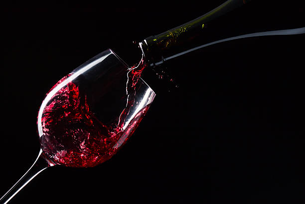 istock bottle and glass with red wine 168810379