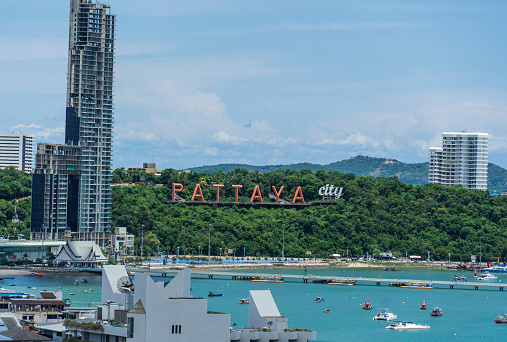 Pattaya city sign on the mountain, Pattaya Thailand. It is a popular tourist destination. Panorama Shot Over Headland And Famous Sign