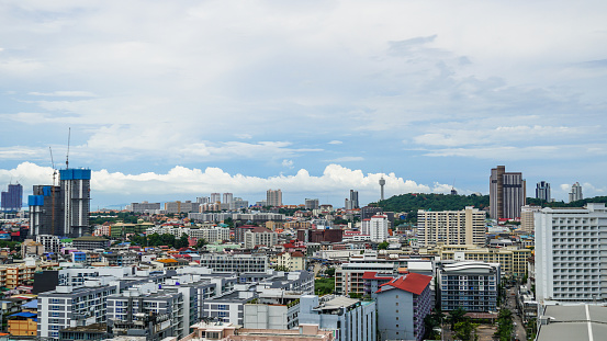 Buildings in the city full of condos and hotels. High angle photo in Pattaya, Thailand. Landscape, Panorama sunny view.