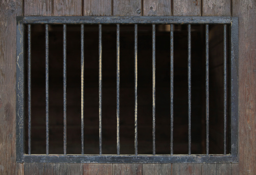 Close up of steel bars in a wooden building