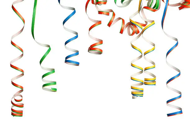 Bunch of party streamers hanging in the air.  Photographed in studio isolated on white background.