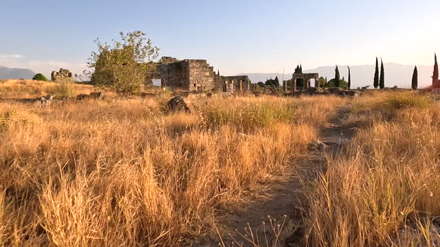 Walking in agora of ancient ruins of Hierapolis during sunset in  Pamukkale in Denizli