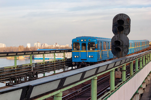 Kyiv, Ukraine - January 07, 2014: View of the old subway train in the elevated part on the bridge over the Dnipro river.