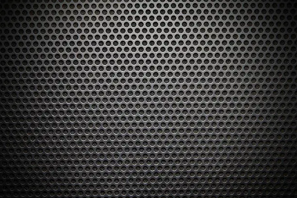 Black speaker lattice background, close-up