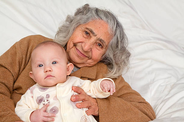 istock Great Grandma Holding Baby 168814240