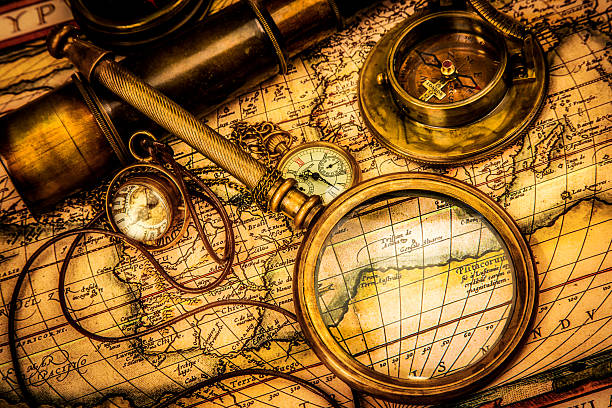 istock Vintage magnifying glass lies on an ancient world map 168814319