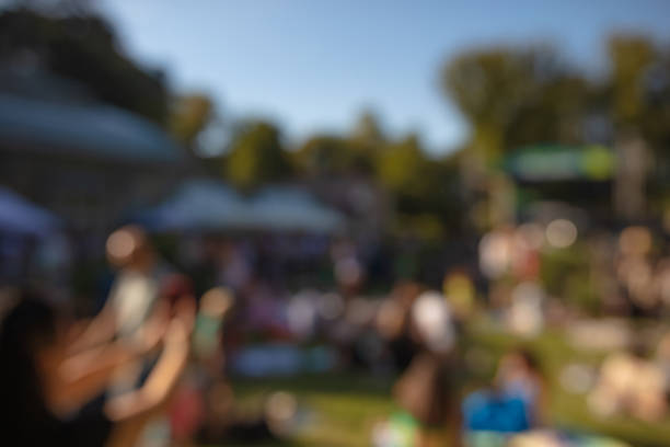 istock De-focused people enjoying daylight public festival. 1688145639