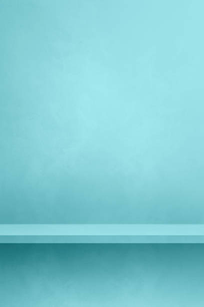 istock Empty shelf on an aqua blue concrete wall. Background template. Vertical mockup 1688146183