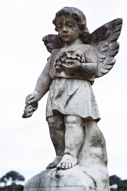 istock Weathered statue of little angel against white background, copy space 168816503