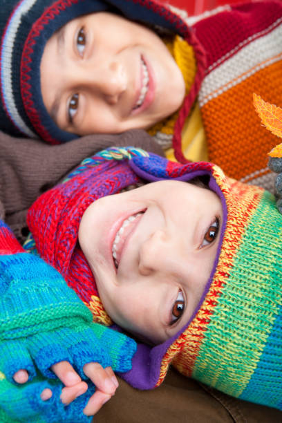 Happy Mixed raced brother and sister in fall attire clothing