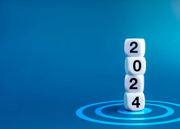 2024 Happy New year banner. 2024 year numbers on white dice cube blocks stacked on target dart icon on blue background with copy space. Start a growth business with goal and success concept.