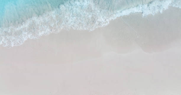 istock Beach Wave water in the Tropical summer beach with  sandy beach background 1688199156
