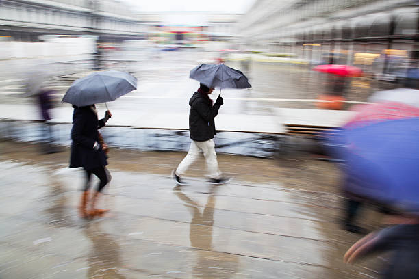 istock people walking in the rain 168819978