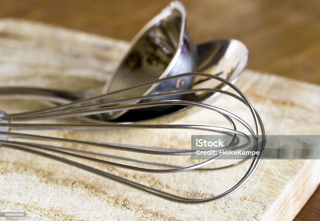 Kitchen utensils Close up of wire whisk, trowel and spoon with very shallow DOF. Close-up Stock Photo