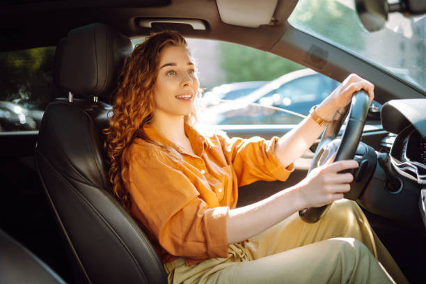 istock Emotional woman drives a car. 1688208499