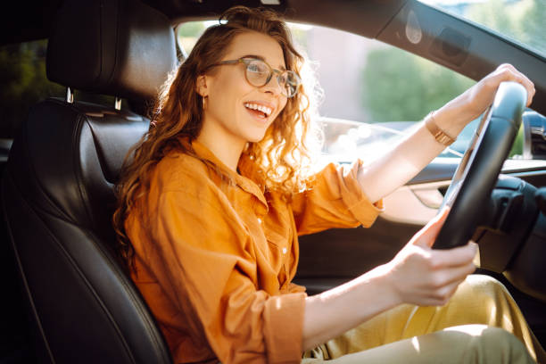 istock Emotional woman drives a car. 1688208524