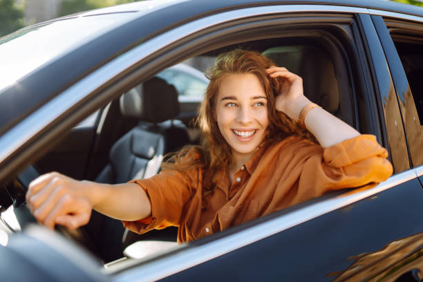 istock Emotional woman drives a car. 1688209049