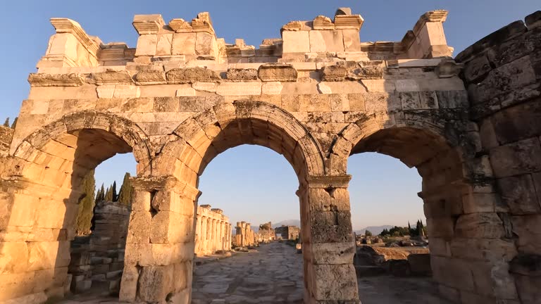 Frontinus Gate and agora of ancient ruins of Hierapolis during sunset in  Pamukkale in Denizli