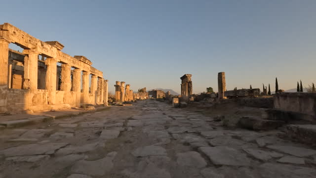 Frontinus Gate and agora of ancient ruins of Hierapolis during sunset in  Pamukkale in Denizli