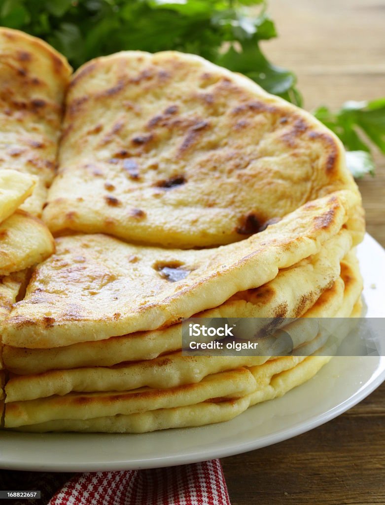 pile of fried bread with butter and parsley Baked Pastry Item Stock Photo