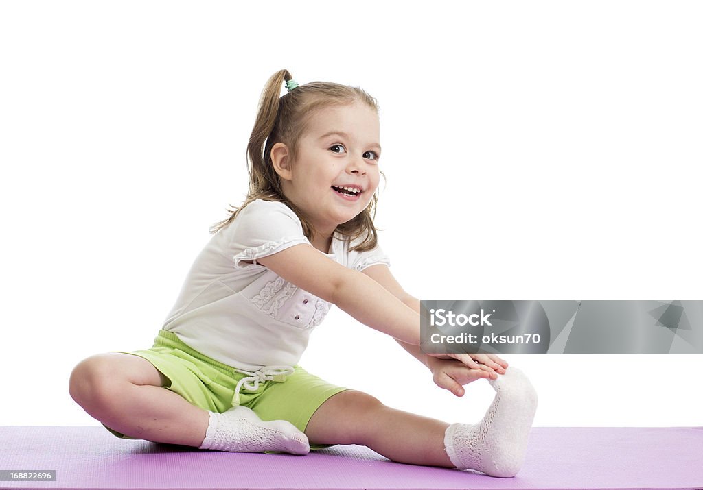 Kid girl doing fitness exercises Activity Stock Photo