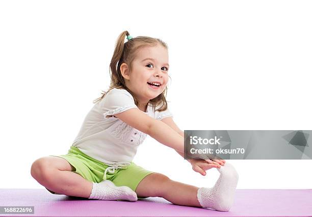 Kid Girl Doing Fitness Exercises Stock Photo - Download Image Now - Activity, Beautiful People, Beauty