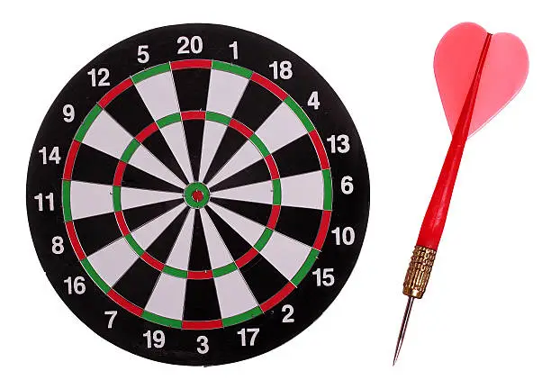 Photo of dart board with red arrow