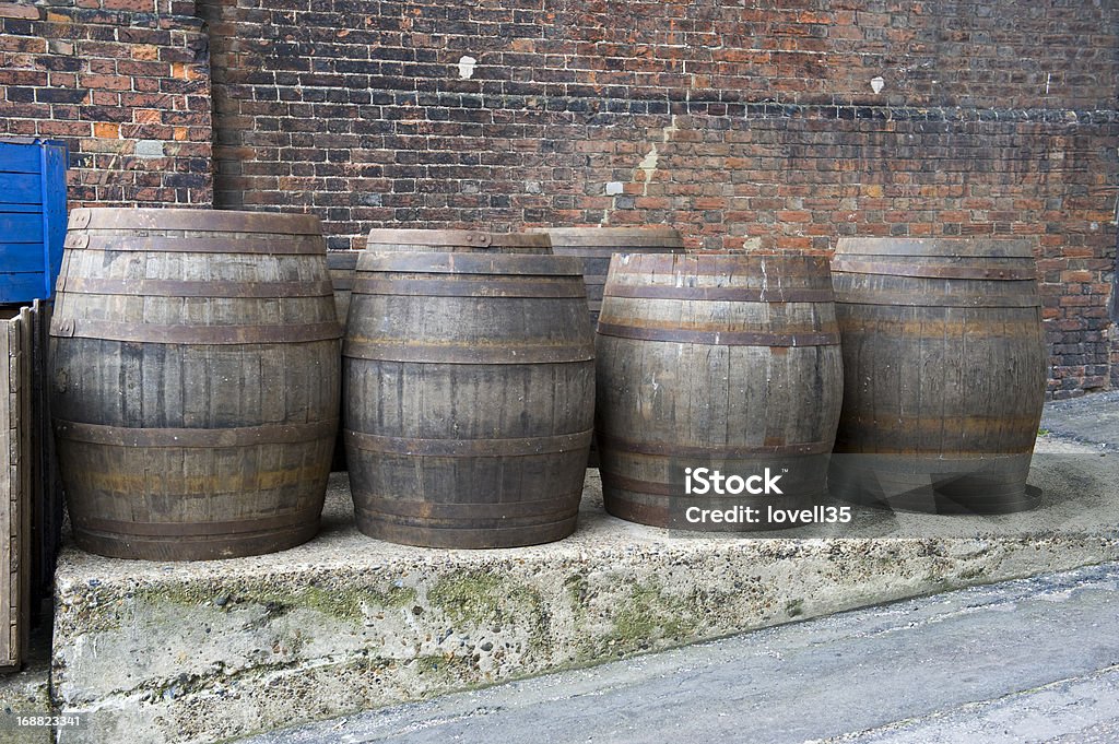 Wooden barrels Old wooden barrels on step at a shipping port Barrel Stock Photo