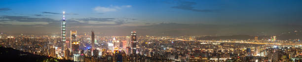 istock Urban Splendor at Night: Watching Dynamic Clouds Above a Dazzling Cityscape. 1688247520