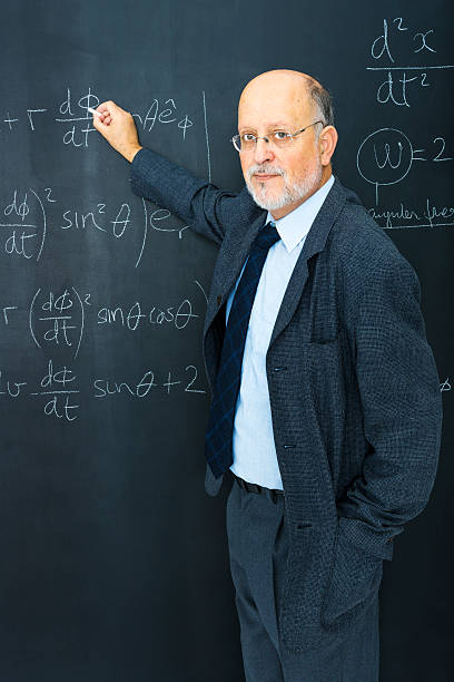 istock Science teacher writting at blackboard physics equation 168825257