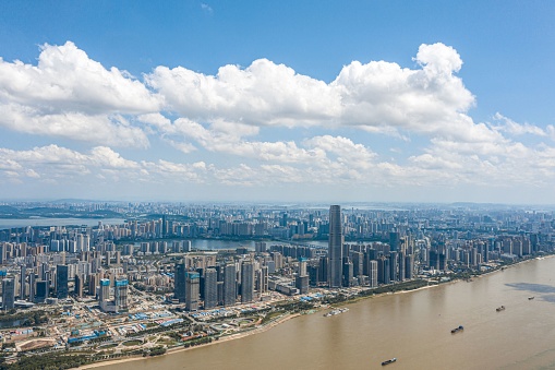 An aerial view of Wuhan skyline in China with modern skyscrapers along the Yangtze River
