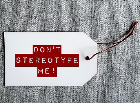 White tag with red text message - Don't stereotype me! -  to stop stereotypes or generalization about how a group of people behaves, unfair and untrue belief about others