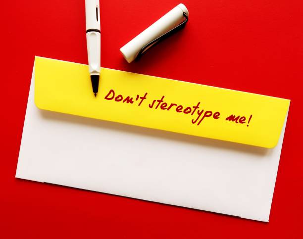 istock Yellow office envelope with handwritten message - Don't stereotype me! -  to stop stereotypes or generalization about how a group of people behaves, unfair and untrue belief about others 1688280152