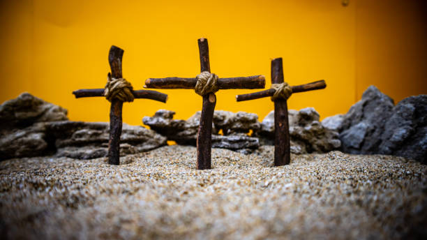 istock crosses stuck in the sand on an orange background 1688293508