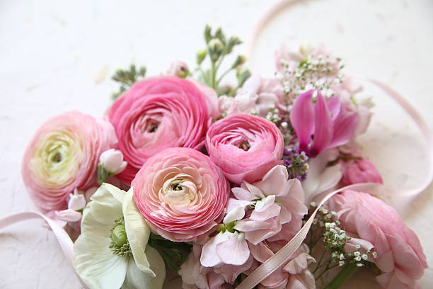 istock pink flowers with ribbon 168829882