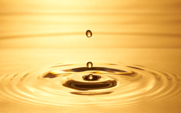 istock Group of water droplets fall and bounce on a water surface 1688315049